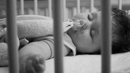 Baby sleeping in crib.