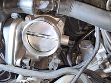 Disconnect sensor on the right side of the throttle body