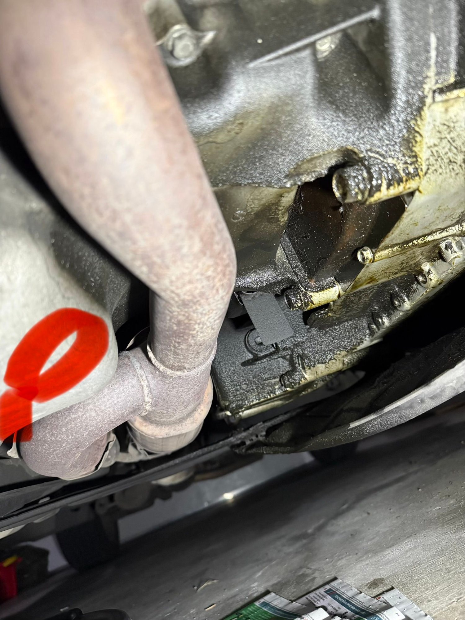 I took the photo from the front of the car. The red mark is the oil pan which is pretty clean, And some oil leaking on the right of the photo. The car has oil consumption issue, but I found that oil consumption is mostly happen going up hill. I did highway drive do 300 km. I see very little to non oil consumption. But with local city drive with 80% on hilly area. Oil consumption is pretty bad.