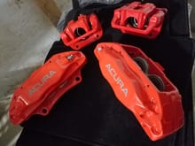 Here is the finished product. They dont look red to me. And all the seals were replaced with new ones except the small one that is between tbe calipers since they were not split open. There are many that say they need to be split open and some that say they dont. This is my second set that have been powder coated by the same place. The first set has mo problems at all. So im not worried about this set either. I cant wait to put them on