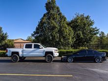 Took some pics with my buddies pavement princess. 6" lift on 35's vs my car 😅😂