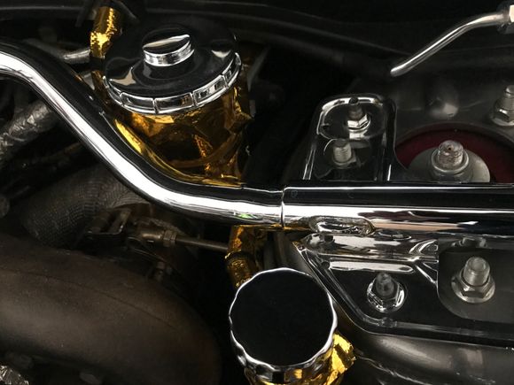 Chrome plated reservoir caps, Oem strut bar, nuts, and bolts.