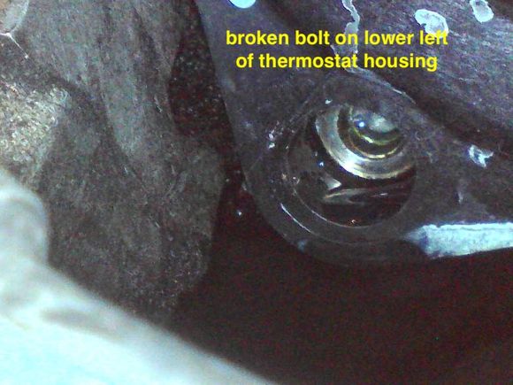 How do I remove broken bolt from thermostat housing?