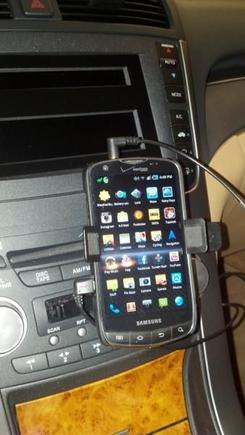 Phone mounted.  Audio and micro-usb cables run under the right-side metal trim.