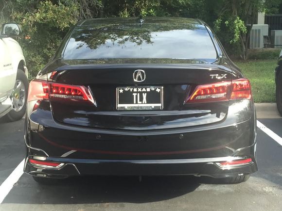 I have thought about debaging mine for a cleaner look too. There still will be no question that it is a TLX, though...