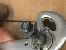 Post that holds the spring. Notice the circle with a flat, which is what holds the cage to the main body.