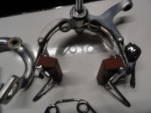 Correct brake blocks but have the upgrade pads.  The spring is non Campy but the right one is below it. 