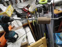 The tool is a spool of wood mounted on an all thread rod, and used with a drill for creating a circular motion of the grit paper.  