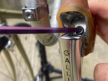 This hex bolt goes through the lever and threads into the band. 