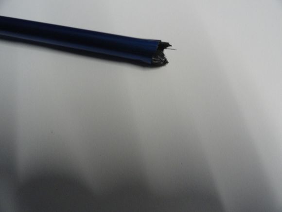 This is what damaged CF looks like.  Note the shards of carbon fibers sticking out from the damaged section.