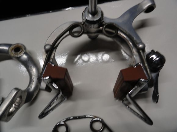 Correct brake blocks but have the upgrade pads.  The spring is non Campy but the right one is below it. 