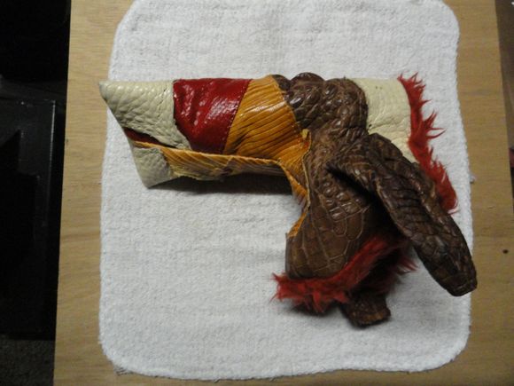 This is my personal putter cover.  Seriously one of a kind.  Made from actual body leather of multiple gator hides.  