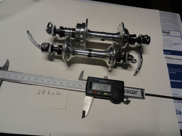 Set C: Campy SR low flange hubs.   Curved skewer levers 28 hole and 126 over nut length.  $120 with USPS shipping.  