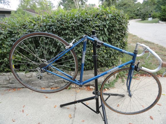 I found a front wheel that is a tubular rim from France that is laced to a Japanese hub, with a very leaky Continental tire.  Added a skewer from Shimano and hung it on the frame.