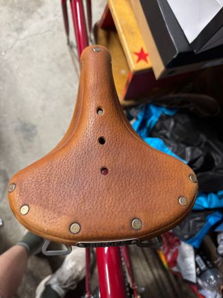 Bought a bike yesterday just for the saddle. Was stored outside and has dried out.  I tried some leather cleaner and a little naphtha to remove some old paint. But before I apply some proofide, is there anything better that might restore some luster?