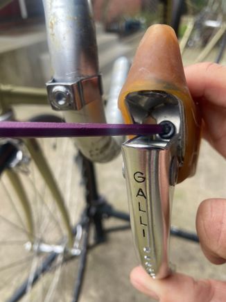This hex bolt goes through the lever and threads into the band. 