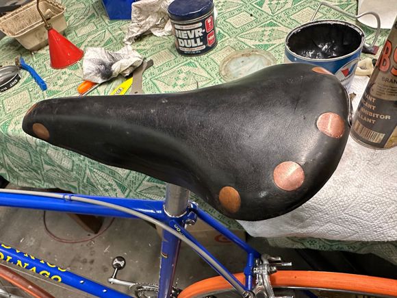 sparing use of black Kiwi polish, rubbed off the excess and followed with Proofide. Rivets I polished with Nevr Dull