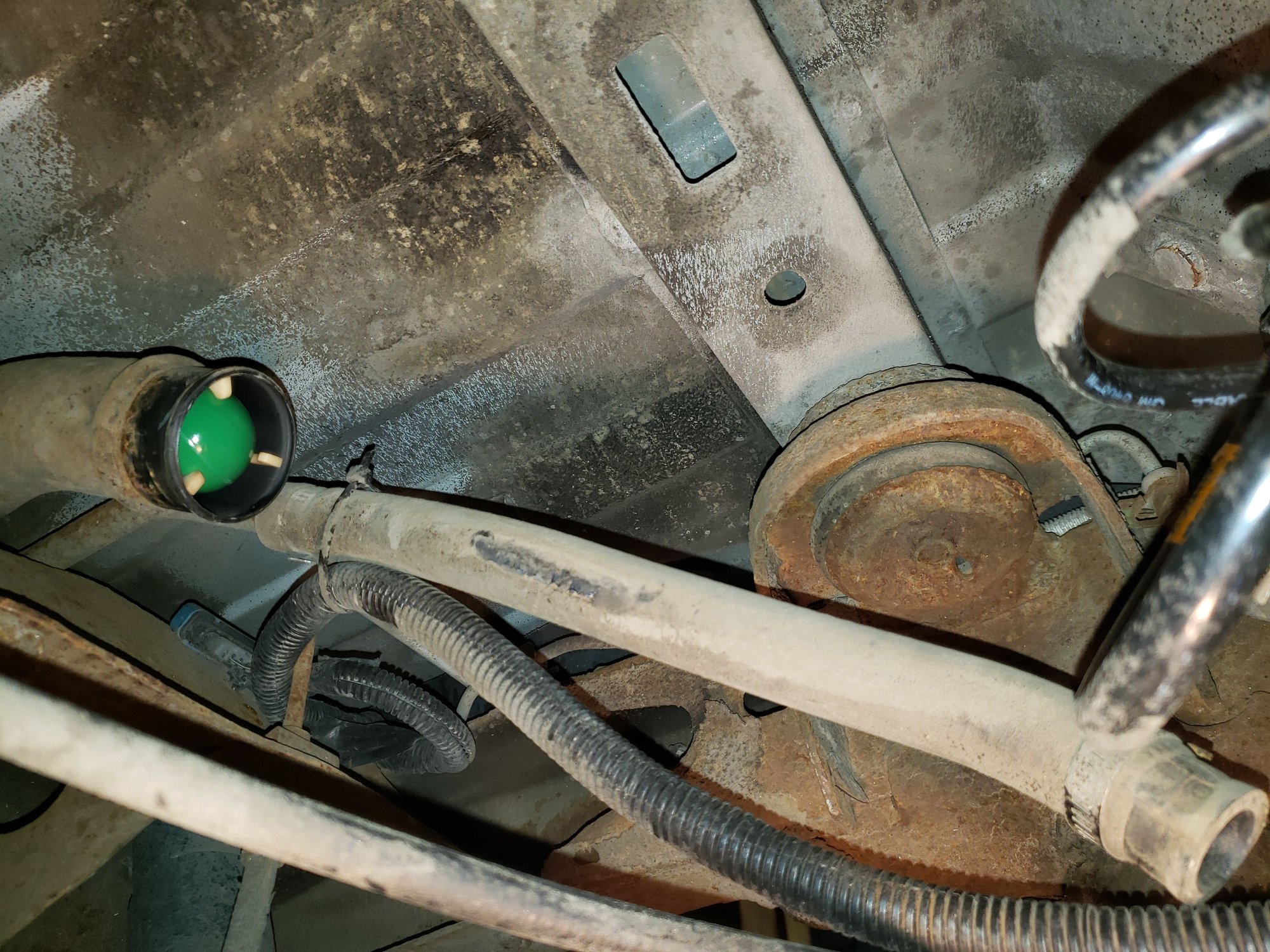 Looking up at the end of the filler tube and at the vent hose. The dark part along the side is where it was fused to the larger one. 