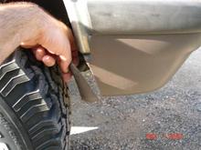 It's much easier to trim the plastic in the front than the metal in the rear.