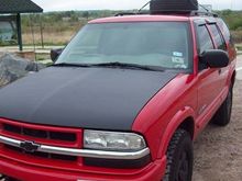 re painted the hood, mounted tire on top, put on window visors