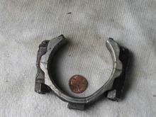 Broken engine/transmission part fell onto driveway after tow home.