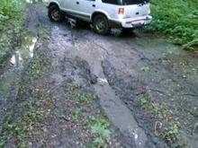 In front and finding the soupy clay is slick as oil. We got it though.