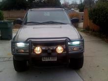 HID 9000K lights and KC daylighters lit up in midday. 2 inch receiver welded to brush guard for 9000LB portable winch mount.