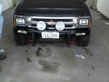 front of the blazer pulled the bumper off painted it and behind it black put my push bar on and off road lights on