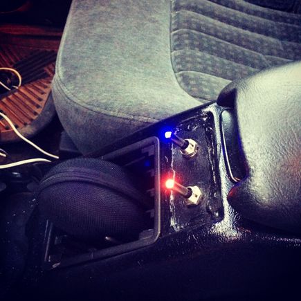 Chopped out the lame change holders and put in some auxiliary switches. Red for my LEDs up front. And blue for my back off “work” light on the back
