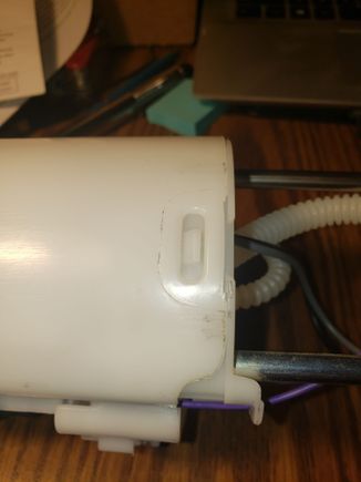 Dirt on the outline of the molding and a scrape at the top (on the right) of the lower body of the assembly.