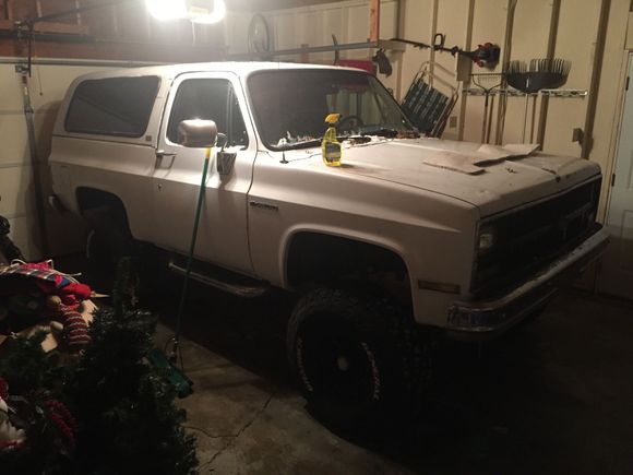 Had to put a few hundred pounds of weights and landscaping blocks and air out the tires to make it low enough to fit in my garage.