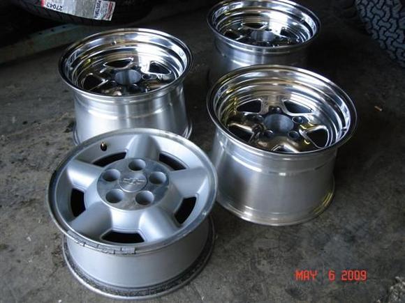 1 of the old wheels next to of the 3 new ones.
