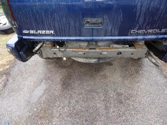 took off the bumper because it was smashed in on one side, and now both rear bumper ends are off.
