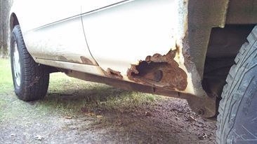 Before body repair, worst side, other side was just surface uck