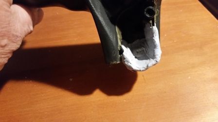 I applied the putty inside the handle as well. Remember the mounting screw will be inside the handle with the end sticking out the bottom of the hole in this view.