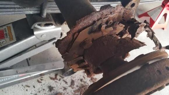 Found parking brake shoes and brake shield disinigrated
