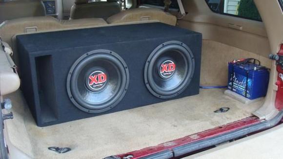 two 12'' american bass XD's eith a ported box. Mounted battery so my lights dont dim.