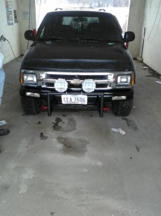 front of the blazer pulled the bumper off painted it and behind it black put my push bar on and off road lights on