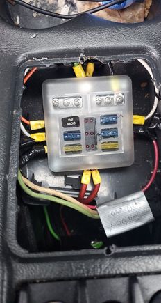 Ran from auxiliary fuse panel in center console.  Its 2 12 awg ran in series 