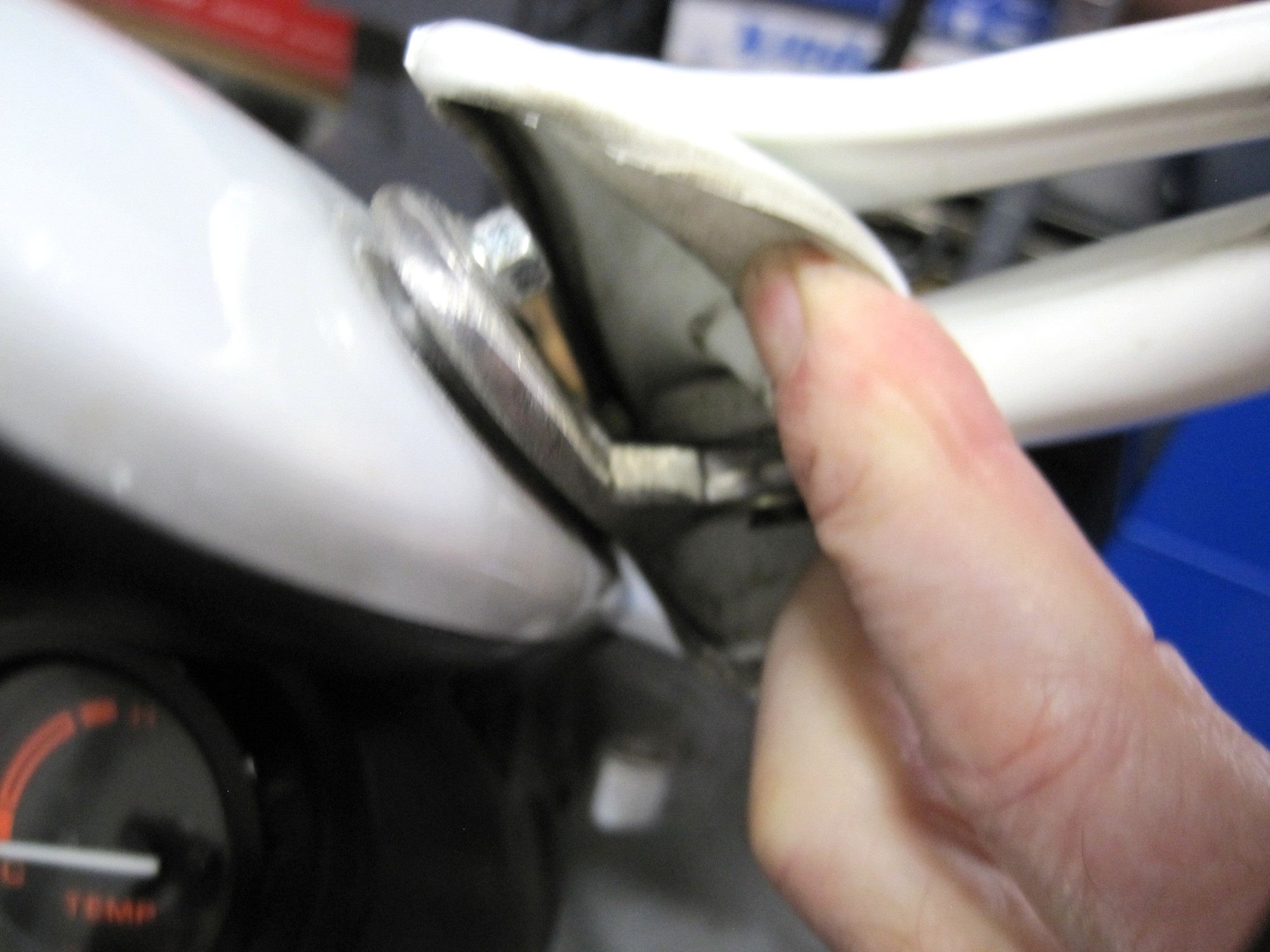 Inner mount at fairing. 2 bolt fastening with a riveted alloy arm to mirror head.