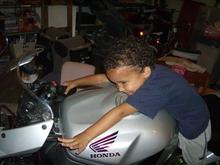 My three year old trying to ride daddy's bike