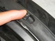 Gash in tire. Tire was replaced.