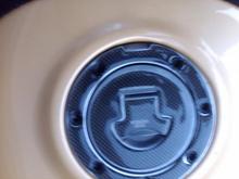 Both the trim and the cap were dull so I covered them and changed the bolts out to black ones.