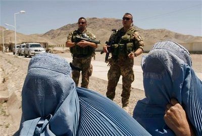 Hanging out while humanitarian aid is being dispensed Herat province