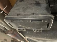 Bracket engaging pockets in canister