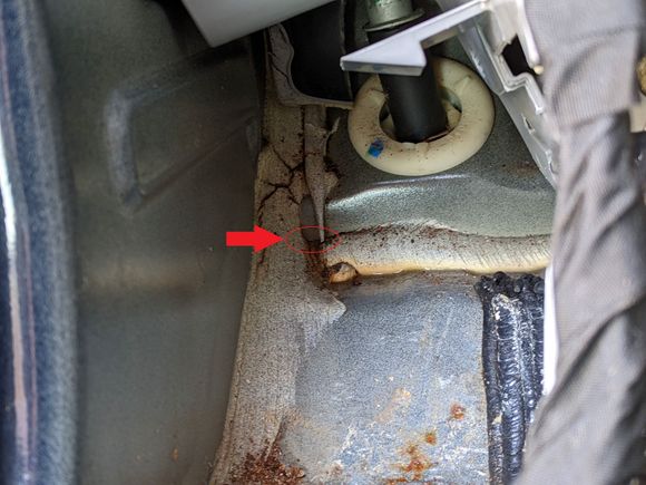Driver's side front near e-brake cable/hood pull, water seems to be coming from this corner when running hose along windshield/front cowl area. 