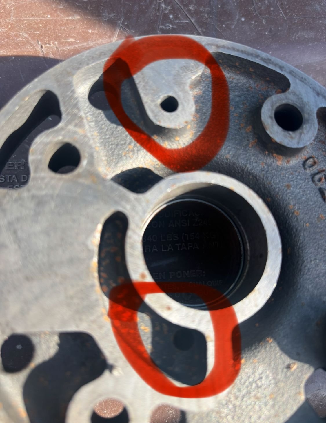 This is the govenor support. The circled holes are the supply and signal passages. 