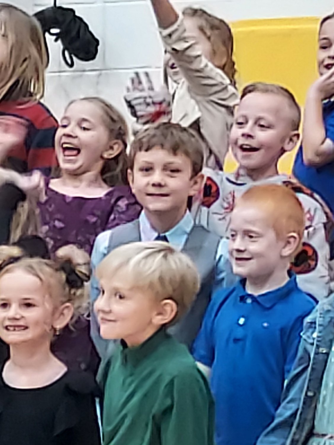 Keegan at his concert in center of picture with grey vest, blue shirt, and tie.  He was looking very dapper!