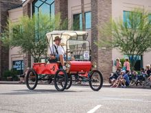 Leading Antique Cars in a Parade