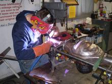 Matt welding the four link on the narrowed ford 9'.